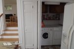 Full size washer/dryer is adjacent to the kitchen